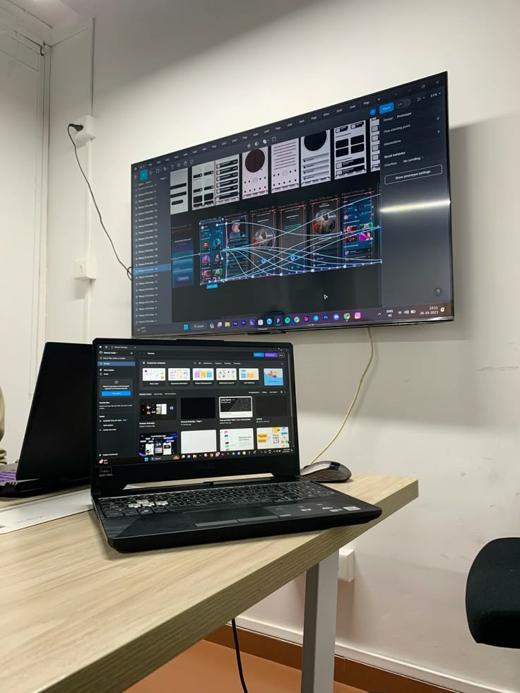 Design studio workspace with Figma on screen
